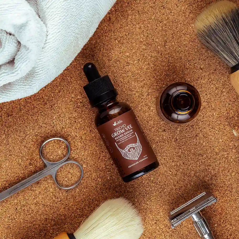 Tricho Grow Vee Beard Serum bottle with grooming tools on cork surface for beard growth and care