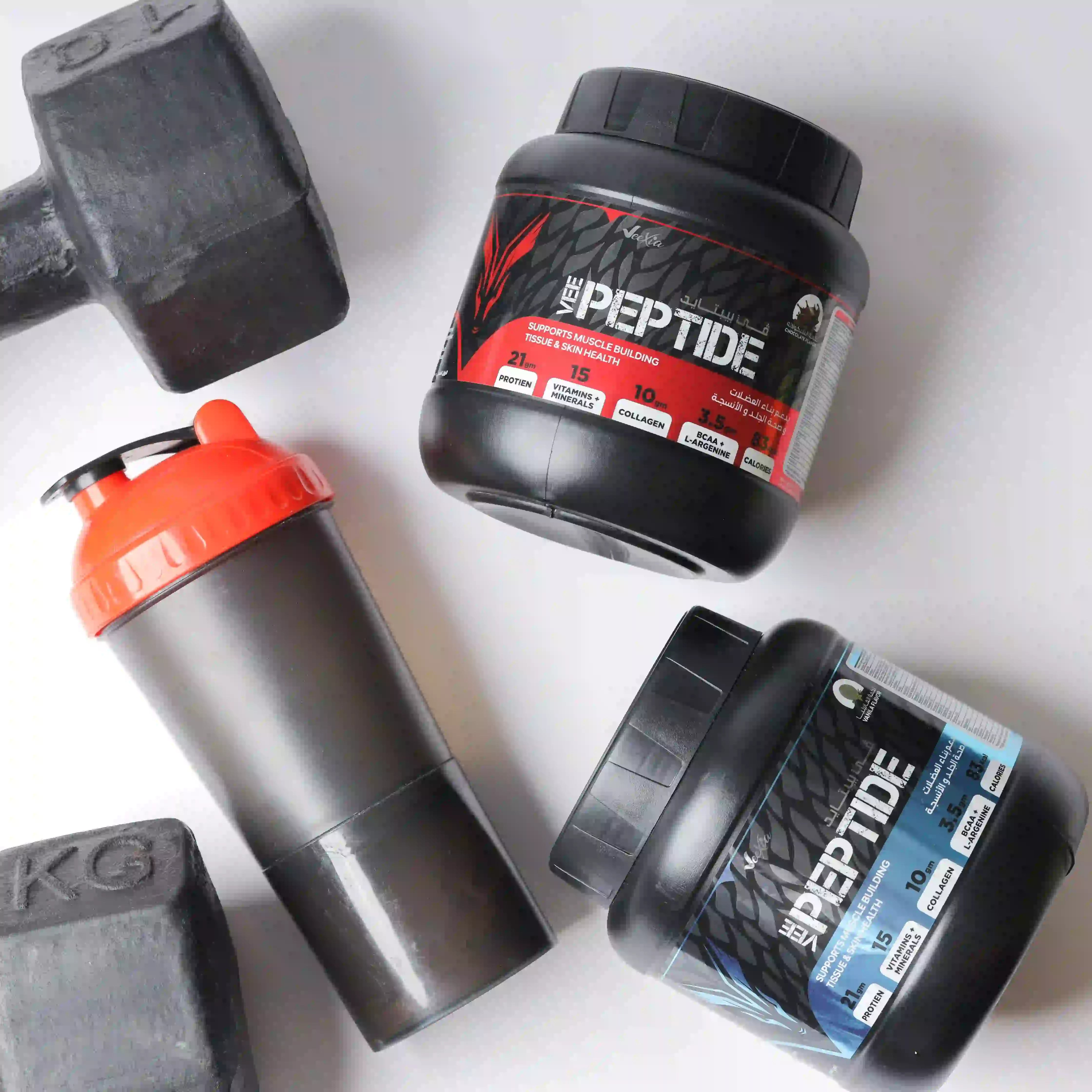 Vee Peptide whey protein powder jars with shaker bottle and dumbbells for muscle support and recovery